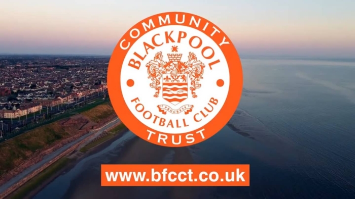Community Blackpool Football Club Trust logo over an aerial view of Blackpool coastline at dusk, with website address www.bfcct.co.uk.